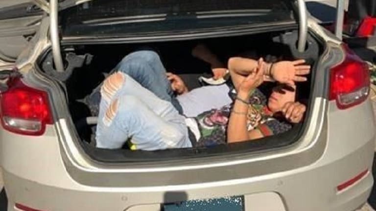 ILLEGAL IMMIGRANTS FOUND HIDING IN TRUNK OF CAR