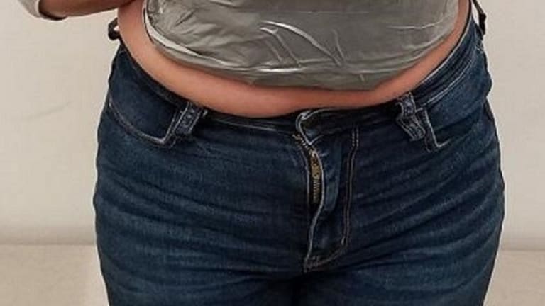  WOMAN TRIED SMUGGLING DRUGS TAPED TO STOMACH 