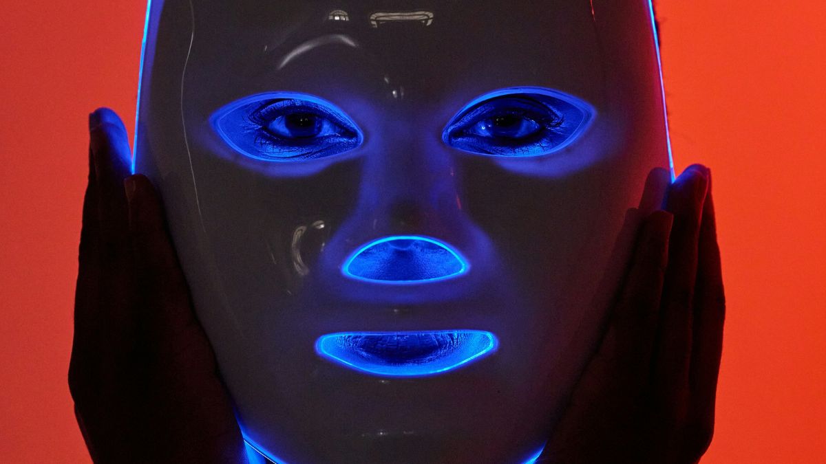 Donning a terrifying red light mask is all the rage, but does it really work?